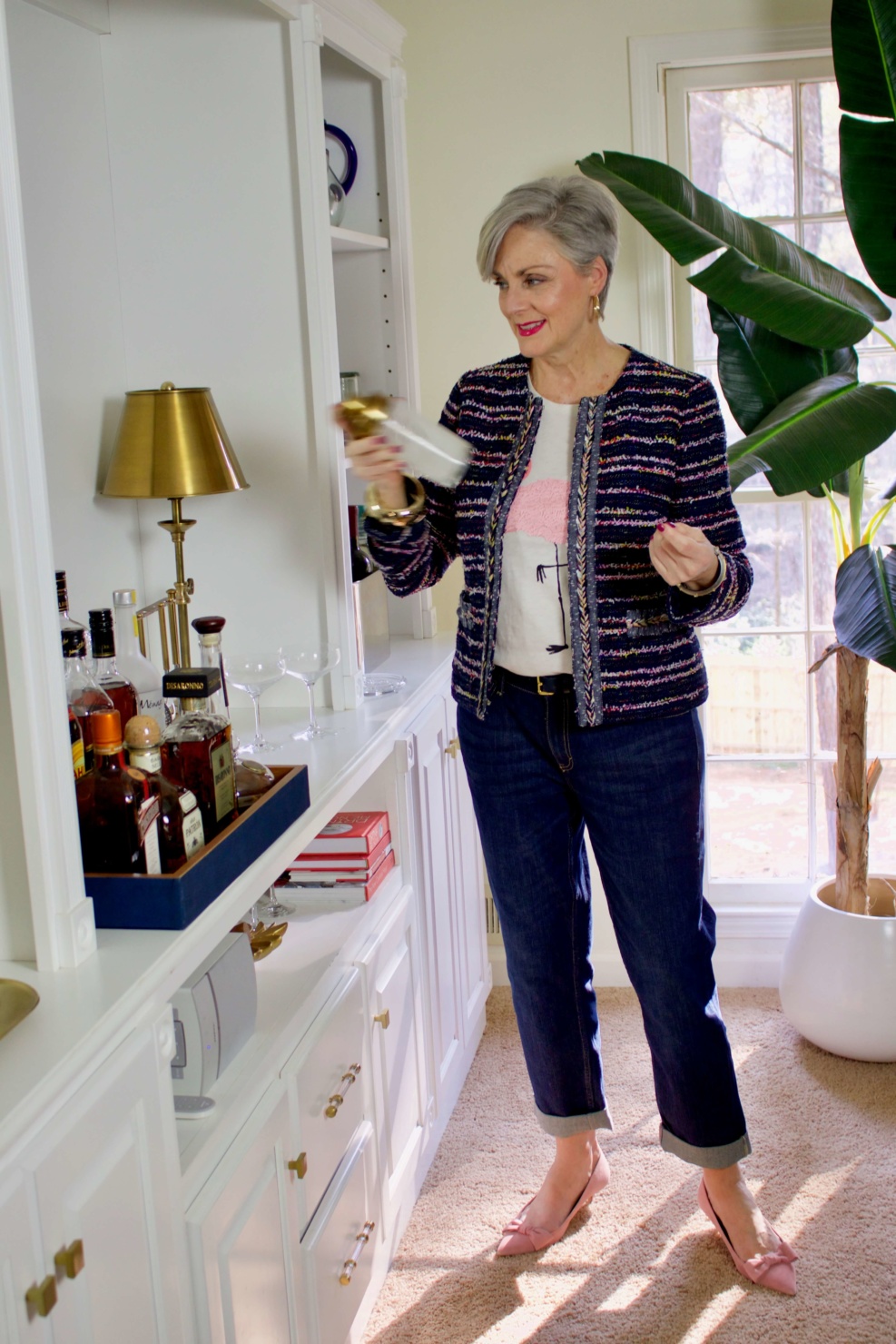 beth from Style at a Certain Age wears boyfriend jeans, graphic tee, tweed blazer and pink kitten heels