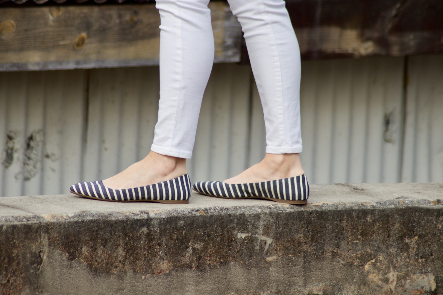 beth from Style at a Certain Age wears a Boden yellow blazer, chambray shirt, white denim and striped shoes