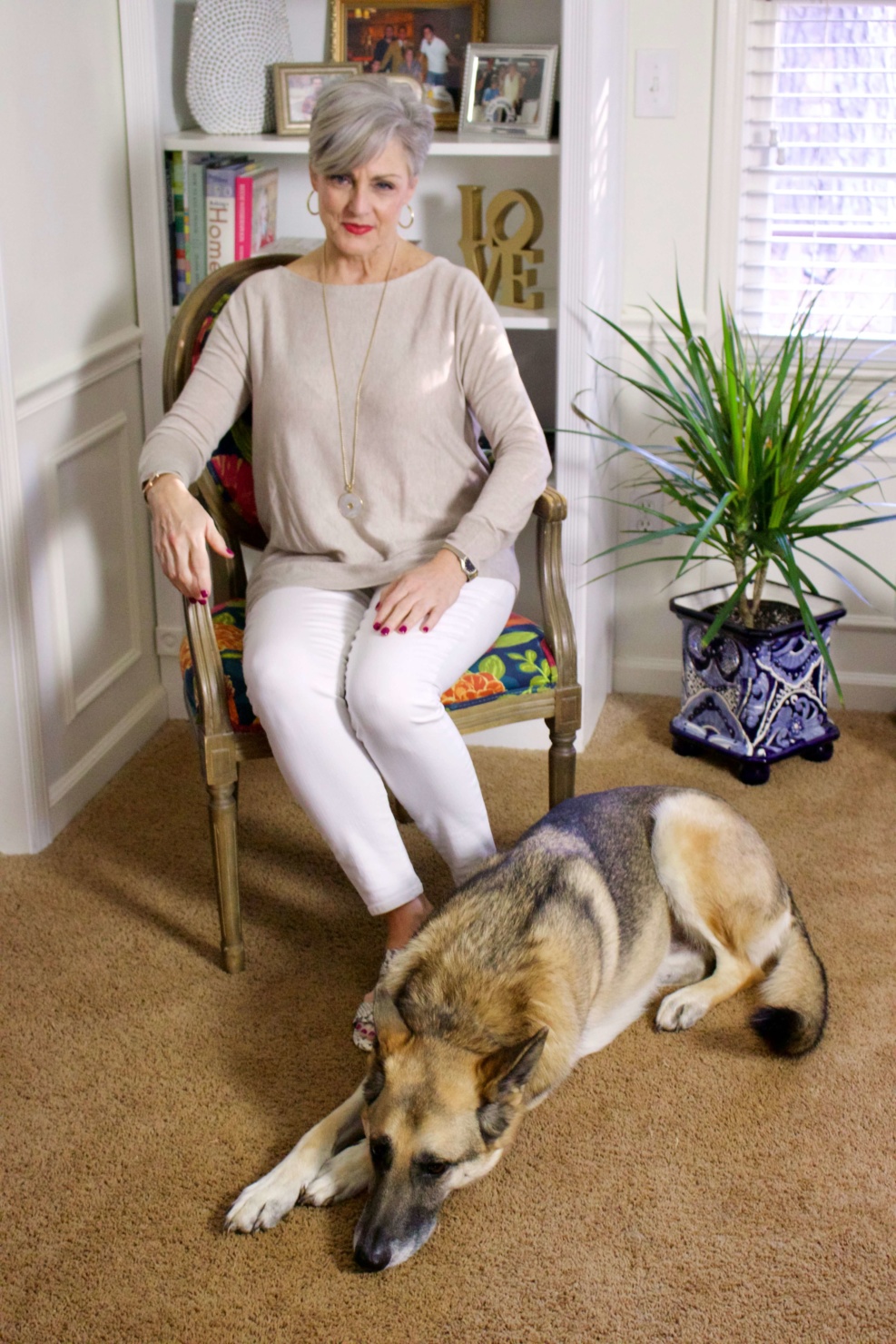 beth from Style at a Certain Age wears spring neutrals, white denim, asymmetrical tunic, snakeskin sandals