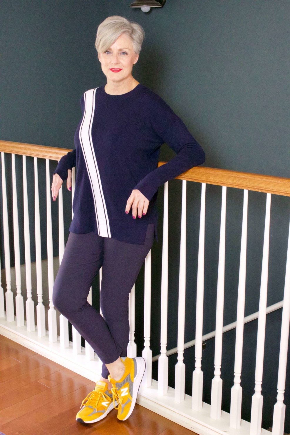beth from Style at a Certain Age wears a travel outfit Athleta wander slim pants and streetwise sweater