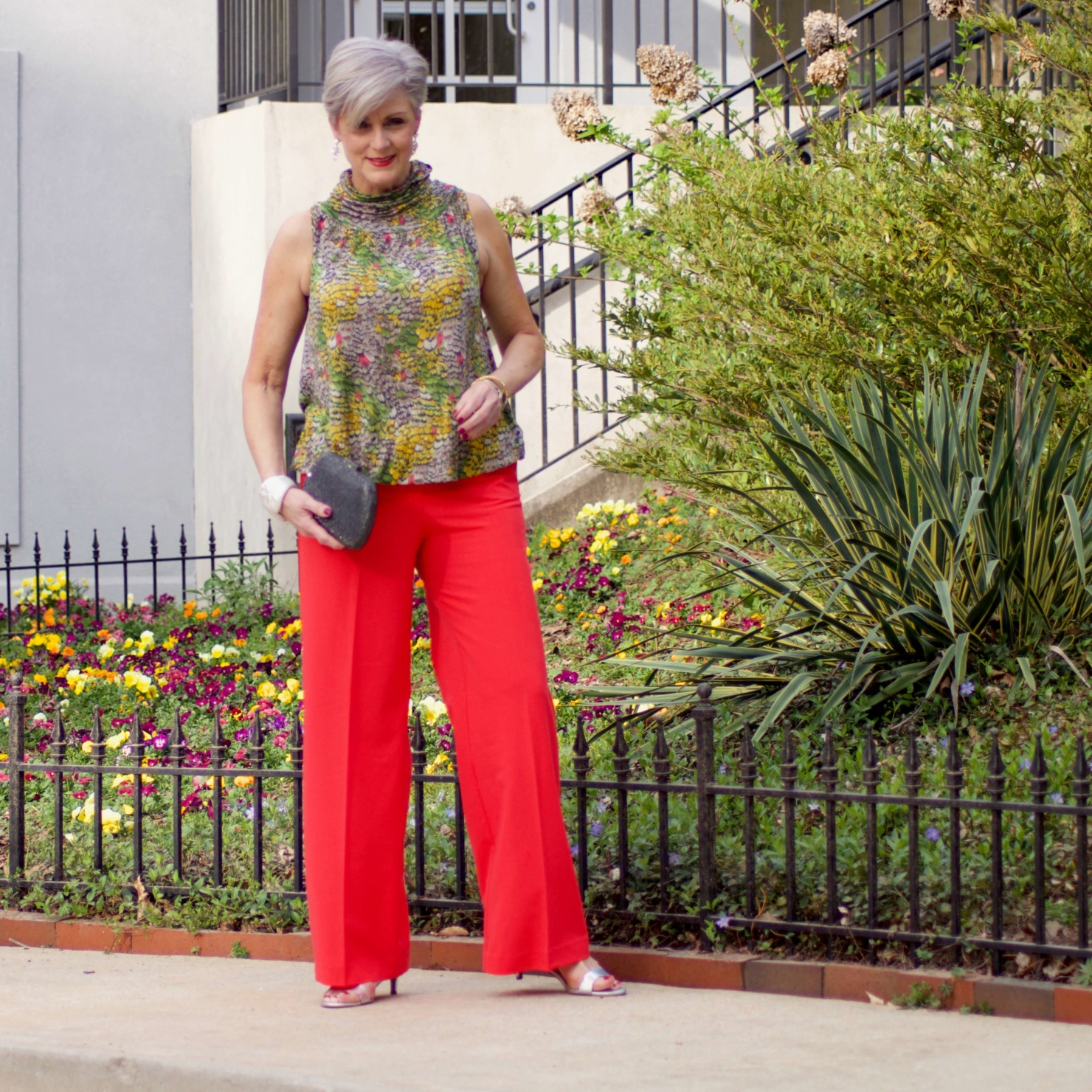 beth from Style at a Certain Age wears wide leg pants from JC Penney, and a sleeveless blouse