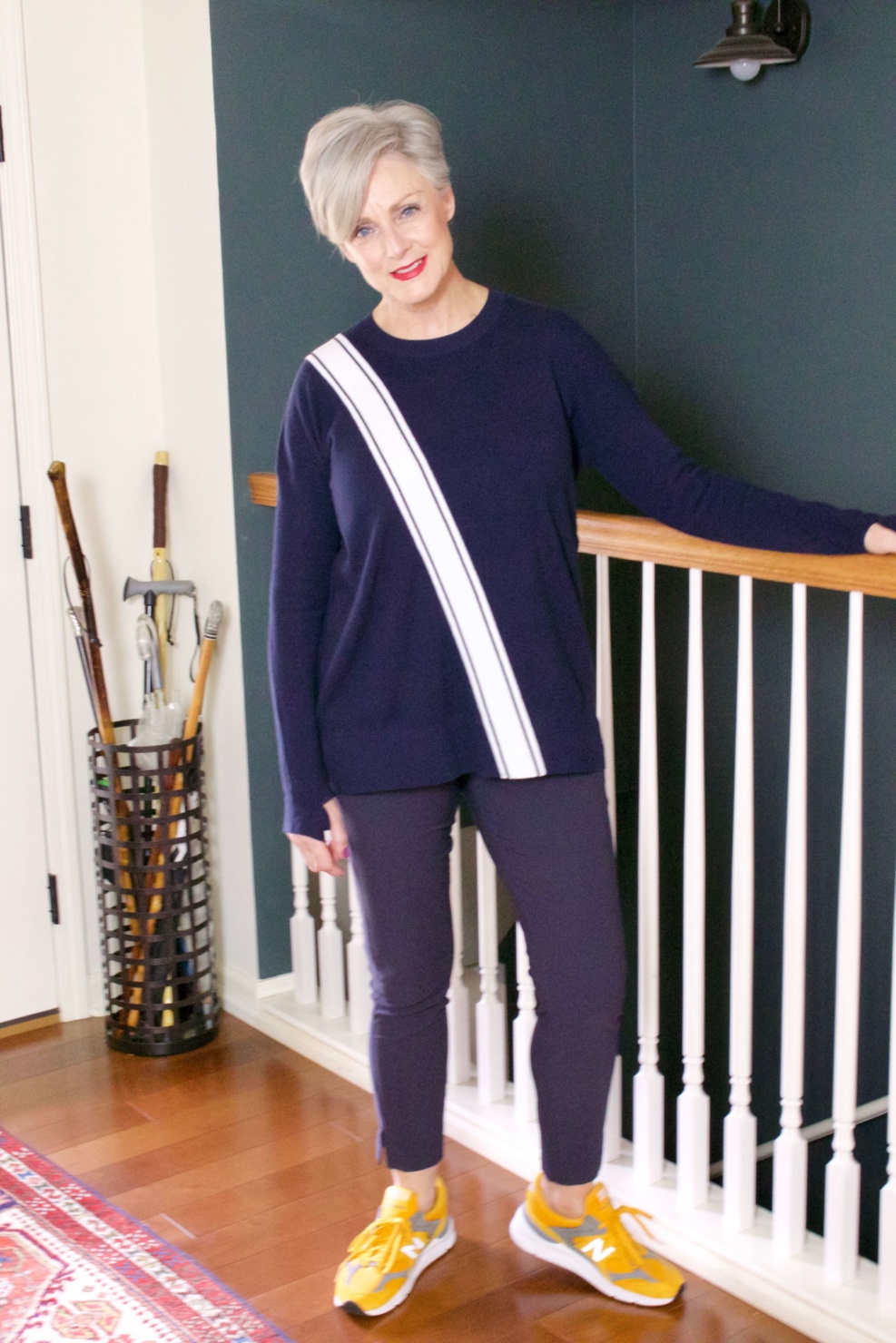 beth from Style at a Certain Age wears travel style Athleta wander slim pants and streetwise sweater