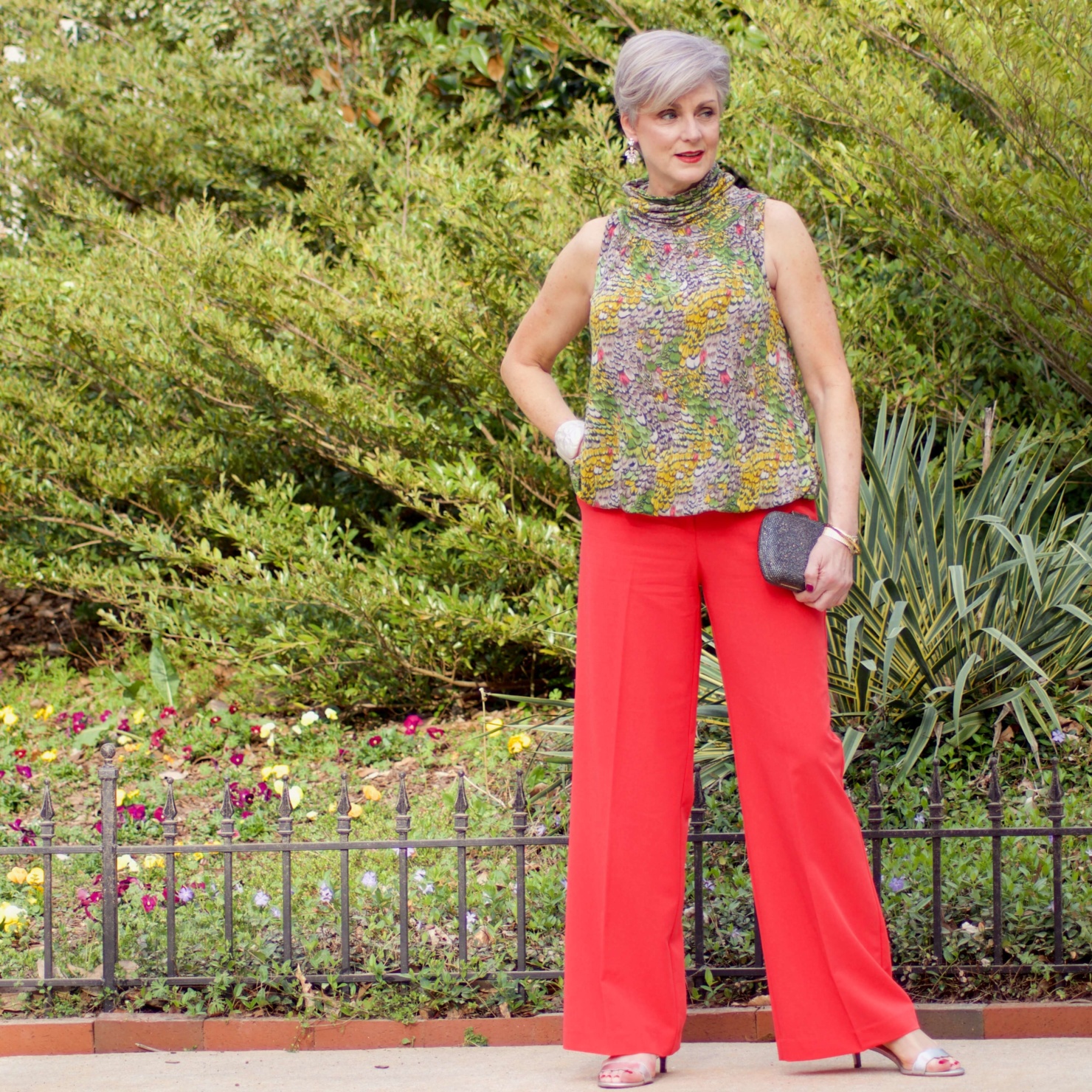 beth from Style at a Certain Age wears wide leg pants from JC Penney, and a sleeveless blouse
