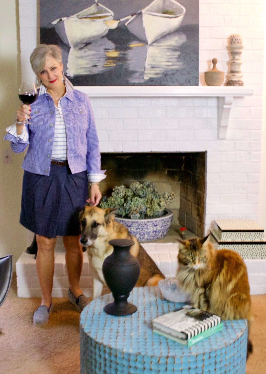 beth from Style at a Certain Age wears a gingham jean jacket, striped shirt, denim skirt, espadrilles and wicker handbag