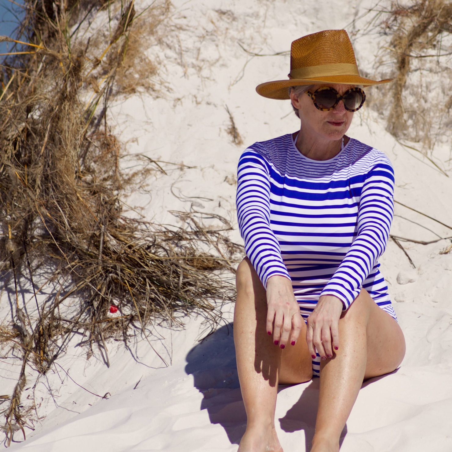 beth from Style at a Certain Age wears a Tommy Bahama Rash Guard and matching bottoms in Panama City Beach