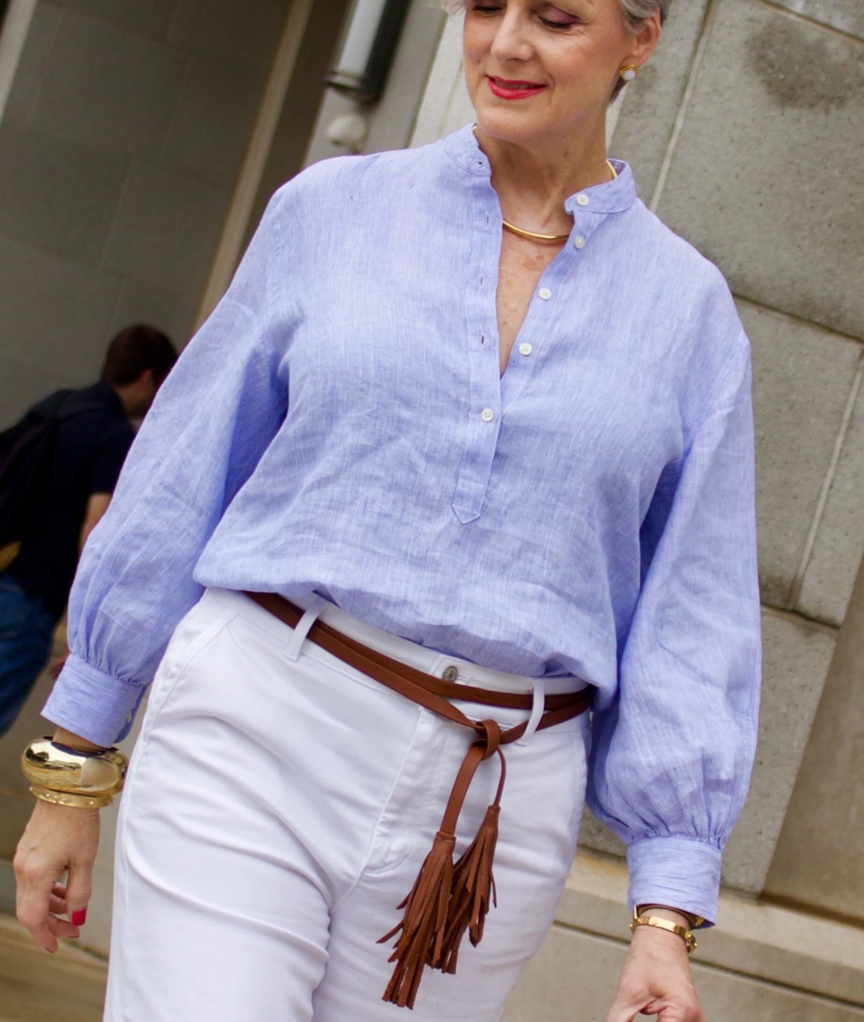 cropped white denim, striped linen shirt, cornhusk handbag, and wedge sandals