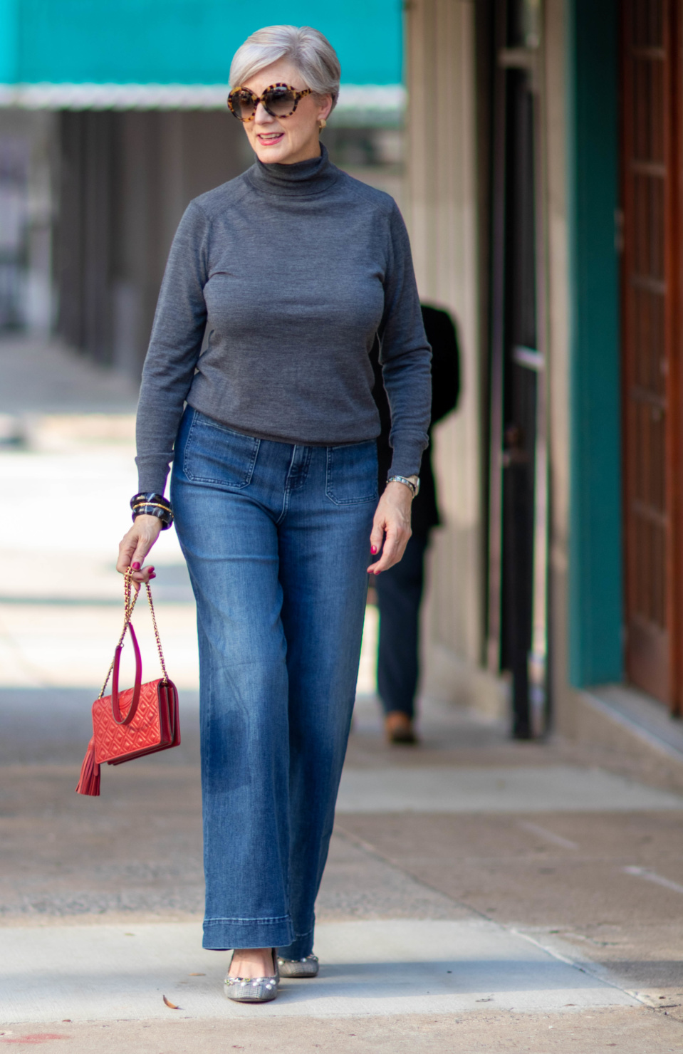 wide leg jeans, gray turtleneck, red handbag