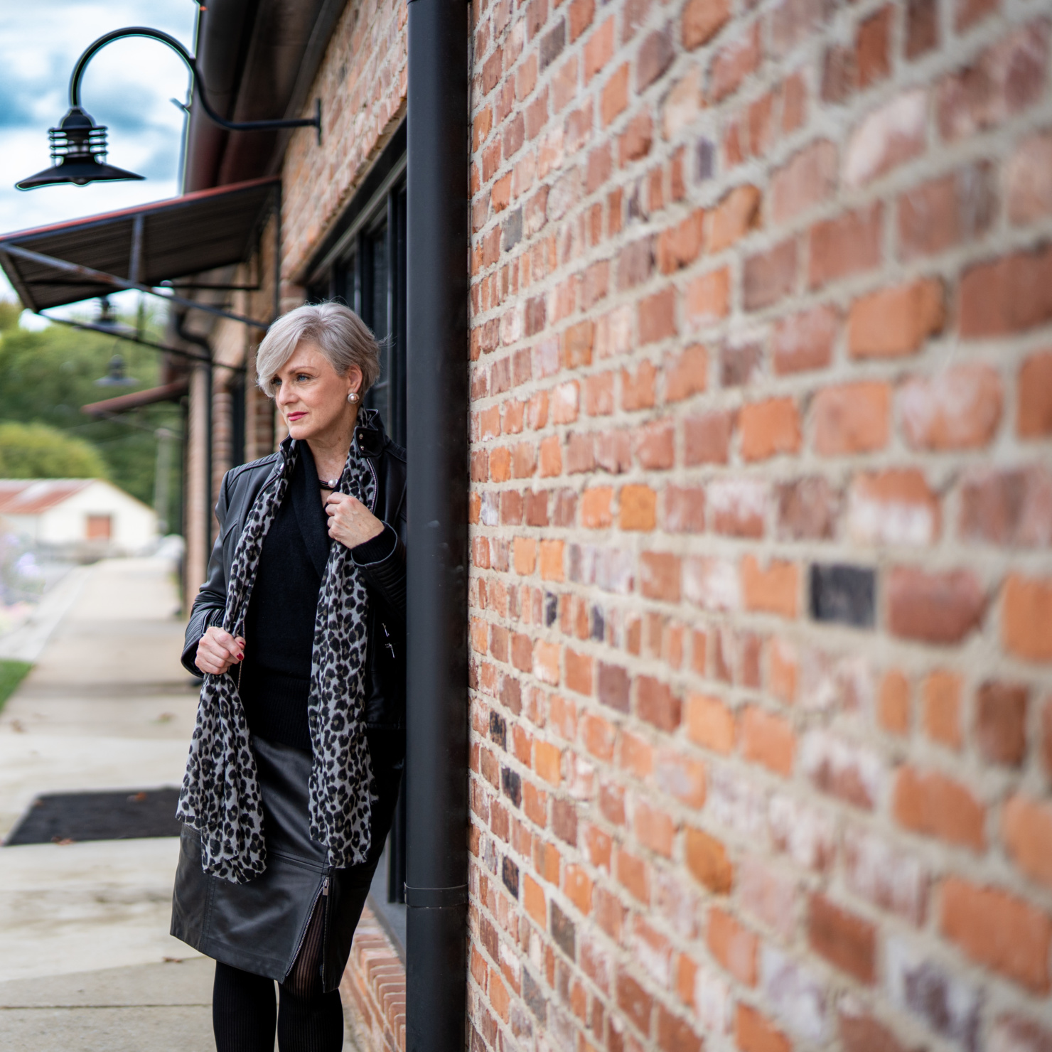 cashmere sweater, leather skirt and leopard scarf