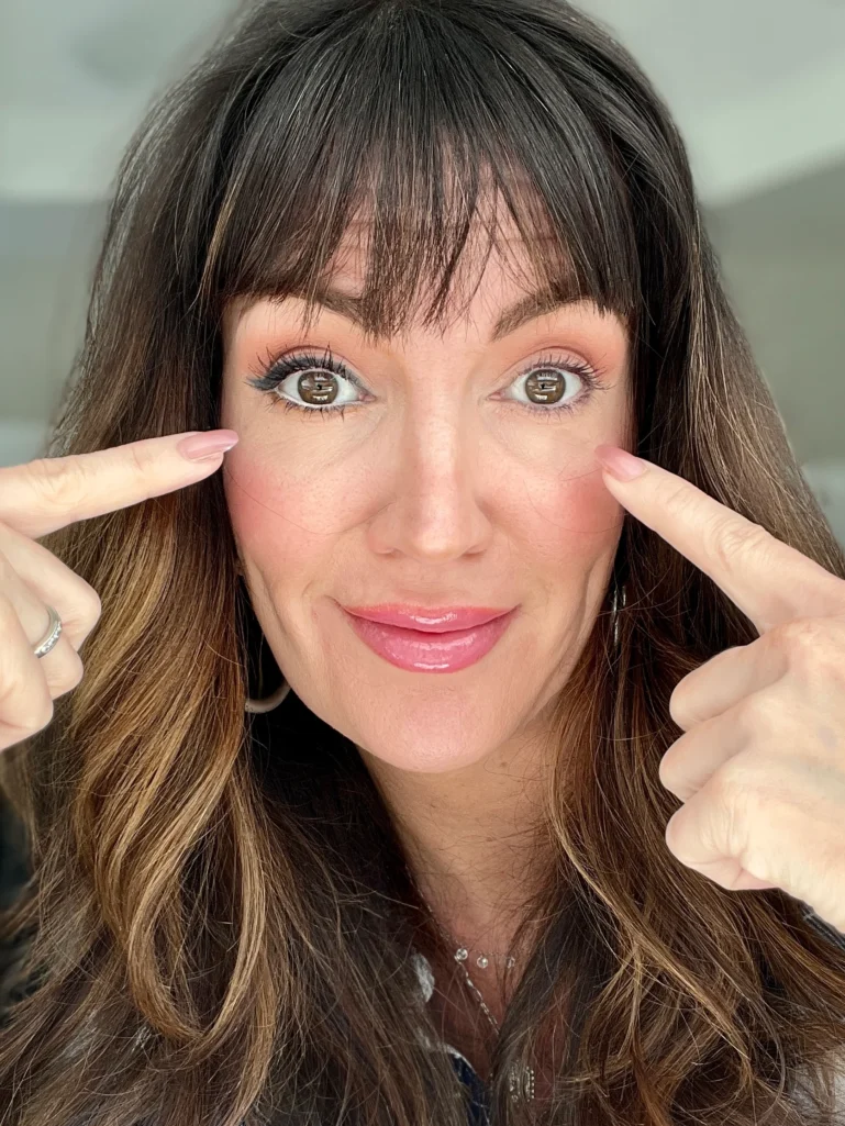 Jennifer showing one eye lined with white, and the other eye unlined