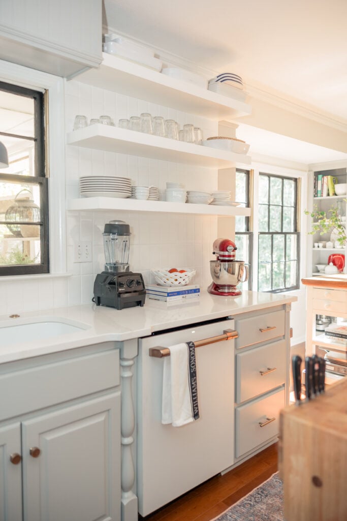 White open shelving with everyday dishes and glassware — practical and timeless 2025 kitchen remodel idea.