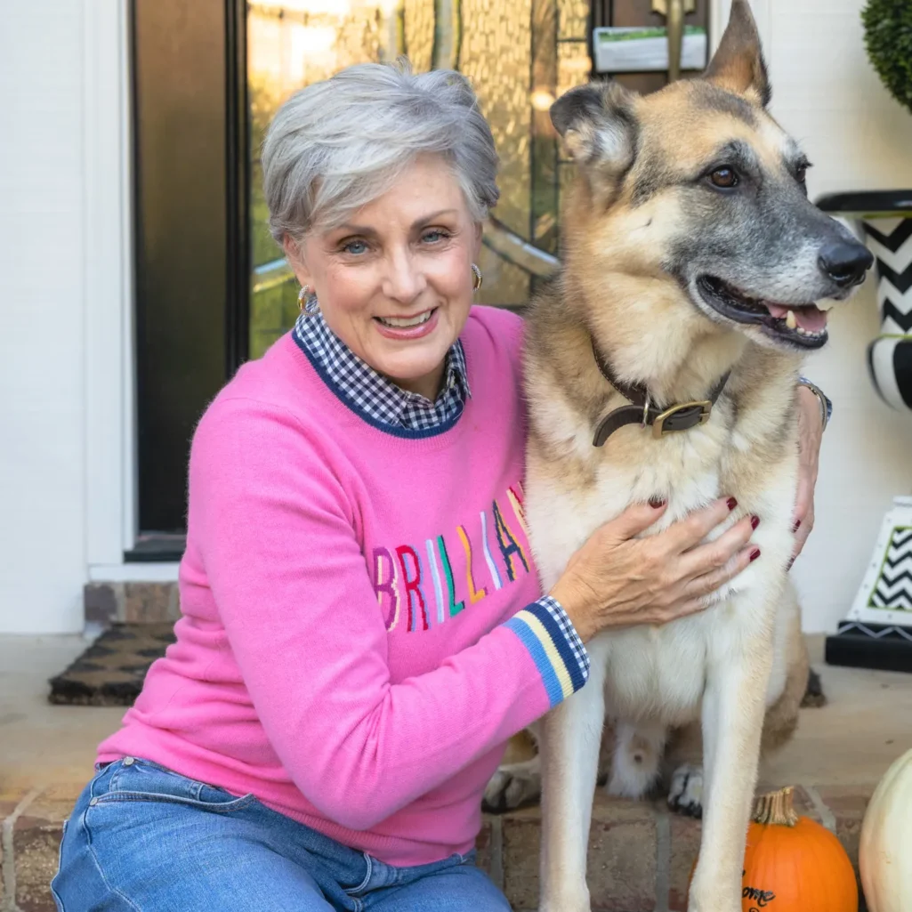Beth in pink "BRILLIANT" sweatshirt with Oscar the German Shepherd showing distinguished grey muzzle - Fridays with Oscar September 2021
