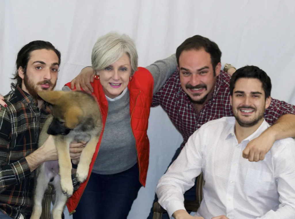 Oscar as tiny German Shepherd puppy held by family in 2014 - first Fridays with Oscar blog appearance