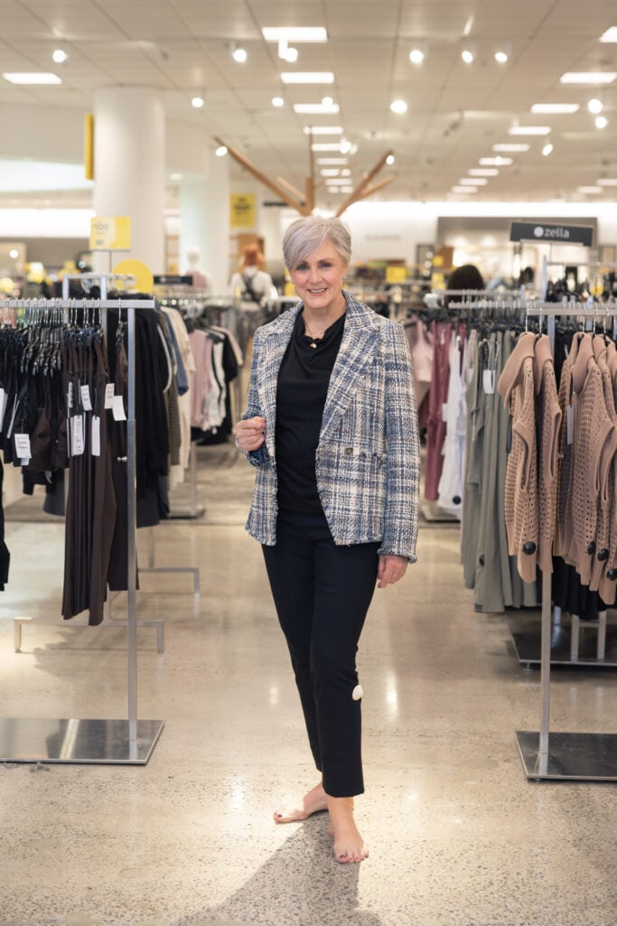 Woman in tweed Veronica Beard blazer and black pants