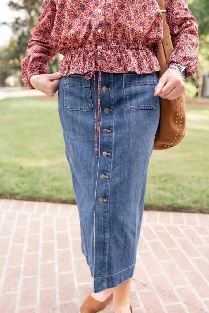 Denim skirt styled with fall textures by Beth Djalali, effortless August outfit.