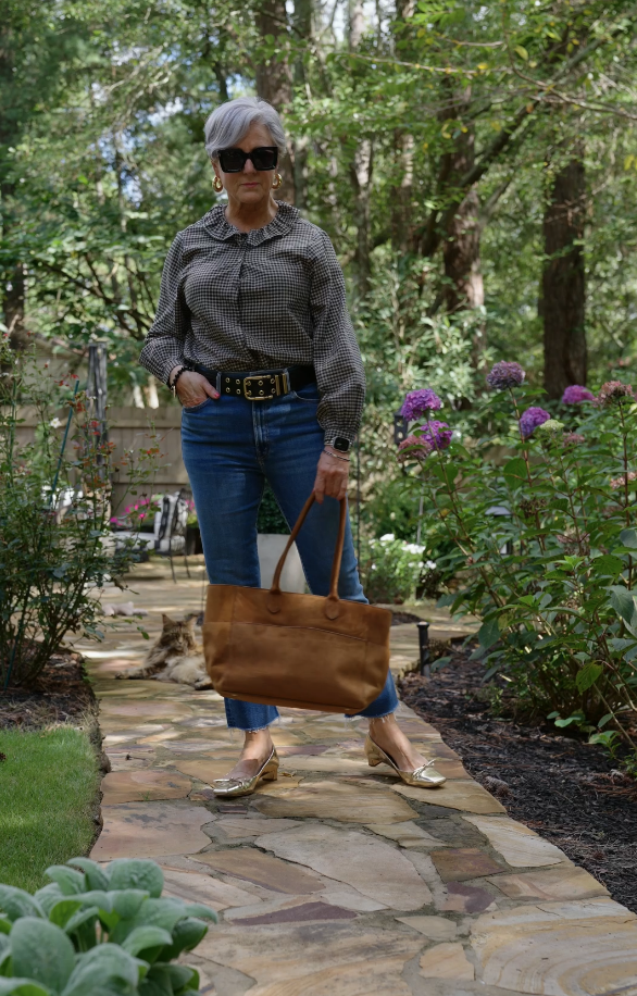 Beth Djalali styling Old Navy blouse with premium denim and statement belt for chic fall look.