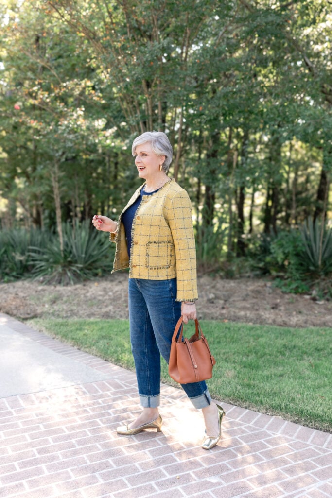 Style at a Certain Age fall outfit inspiration: yellow plaid jacket, denim, gold flats, and timeless accessories for confident dressing. Golden Moments Golden Bachelor