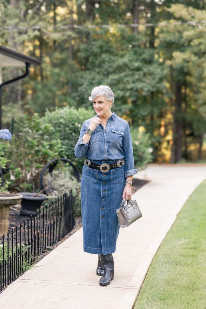 Beth Djalali wearing denim skirt with denim shirt, wide belt, and tall boots