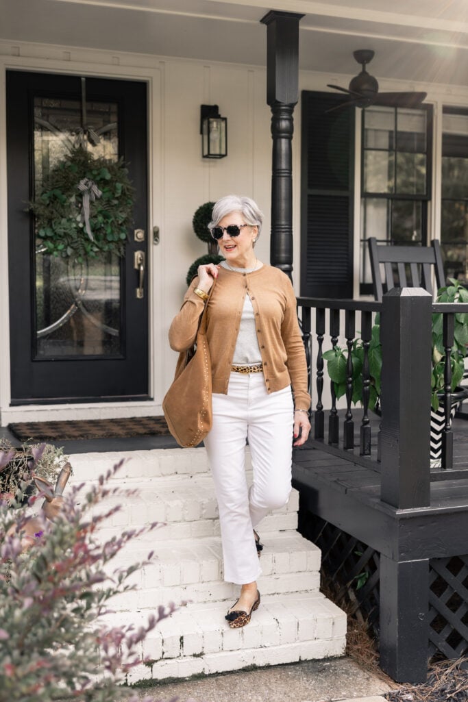 Beth Djalali wearing camel cardigan with white jeans and leopard flats