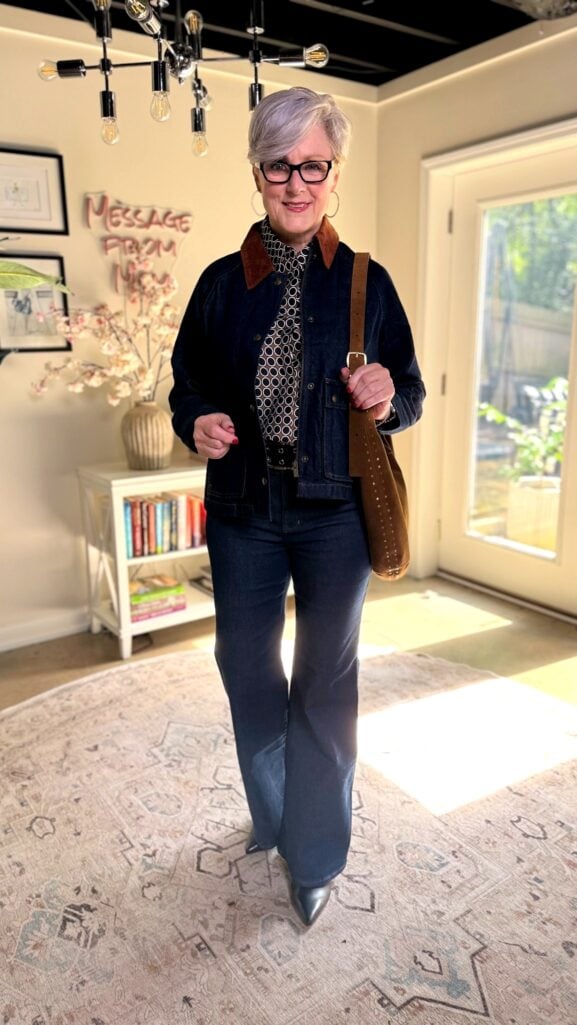 Beth Djalali wearing flare jeans with printed blouse and trapeze denim jacket with corduroy collar