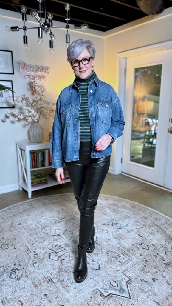 Beth Djalali wearing denim shirt layered over striped turtleneck and faux leather pants