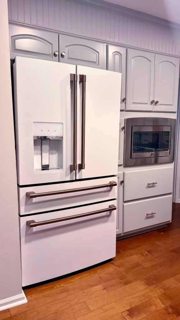 White French door refrigerator with wine drawer and stainless handles — stylish 2025 kitchen remodel upgrade.