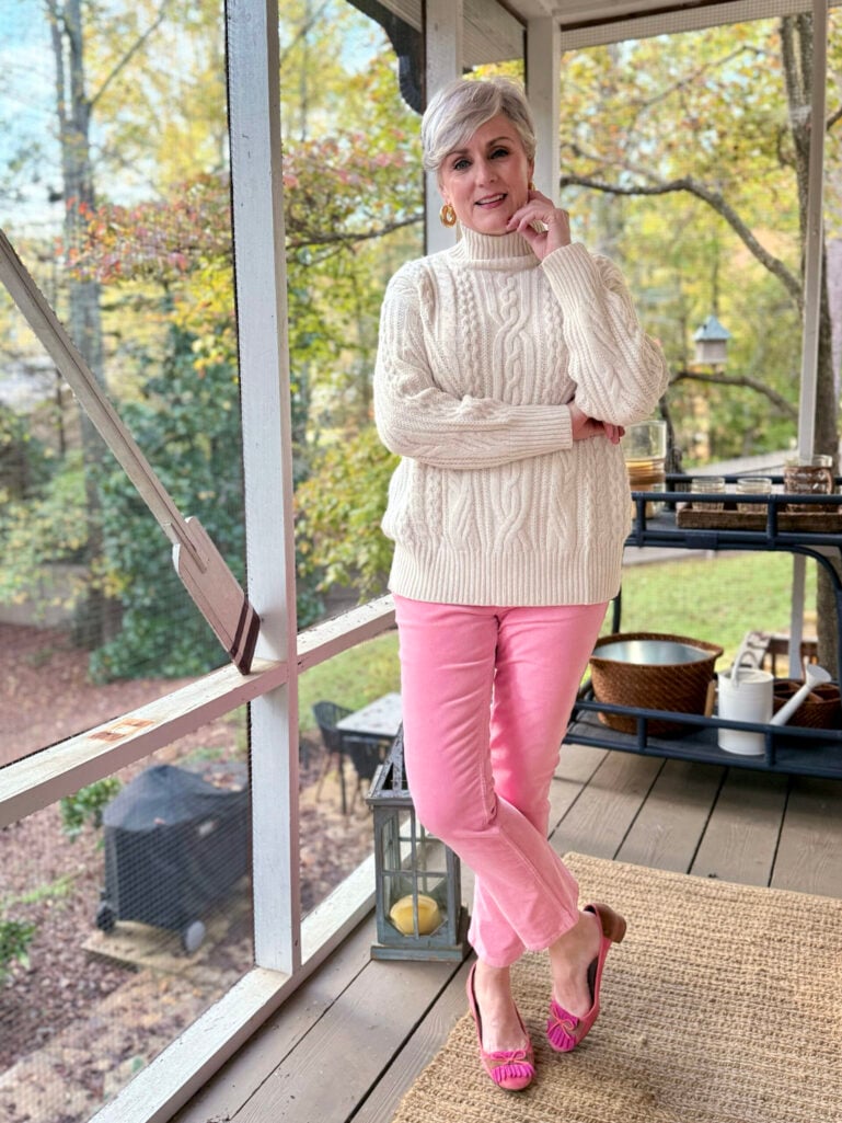 cream sweater and pink pants