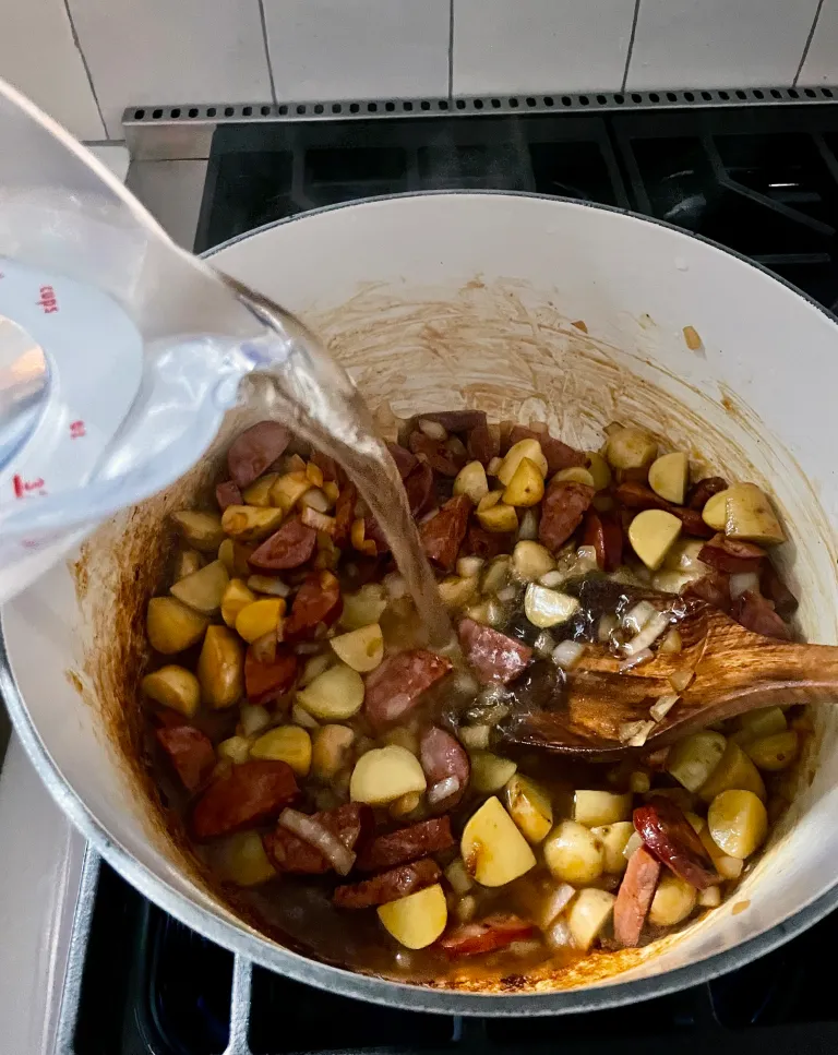 Adding water to the stew