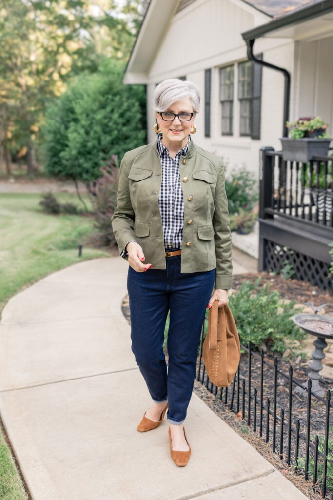 Beth Djalali wearing a green utility jacket from Chico’s styled with denim and suede slingbacks