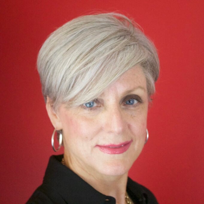 How not to look frumpy and older. Beth Djalali wearing a modern bixie cut.