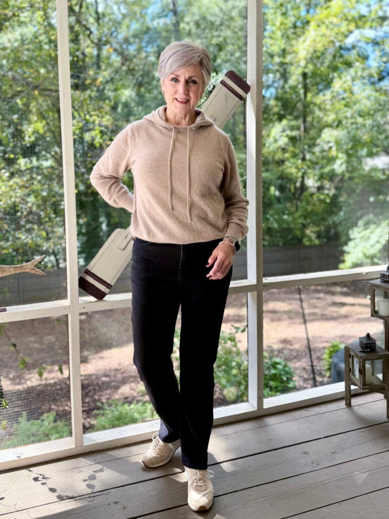 woman wearing a casual weekend outfit: jeans and a sweater