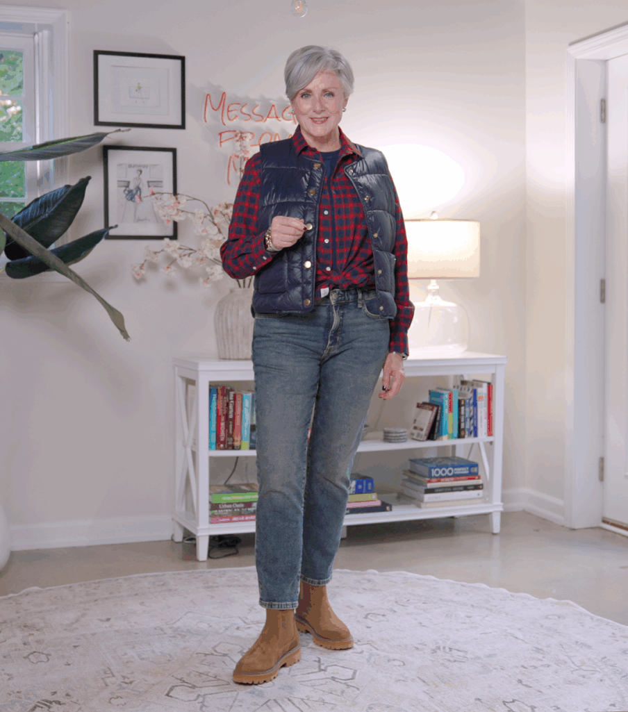 Stylish grandmother in red plaid flannel with quilted vest and suede booties — casual fall weekend outfit.