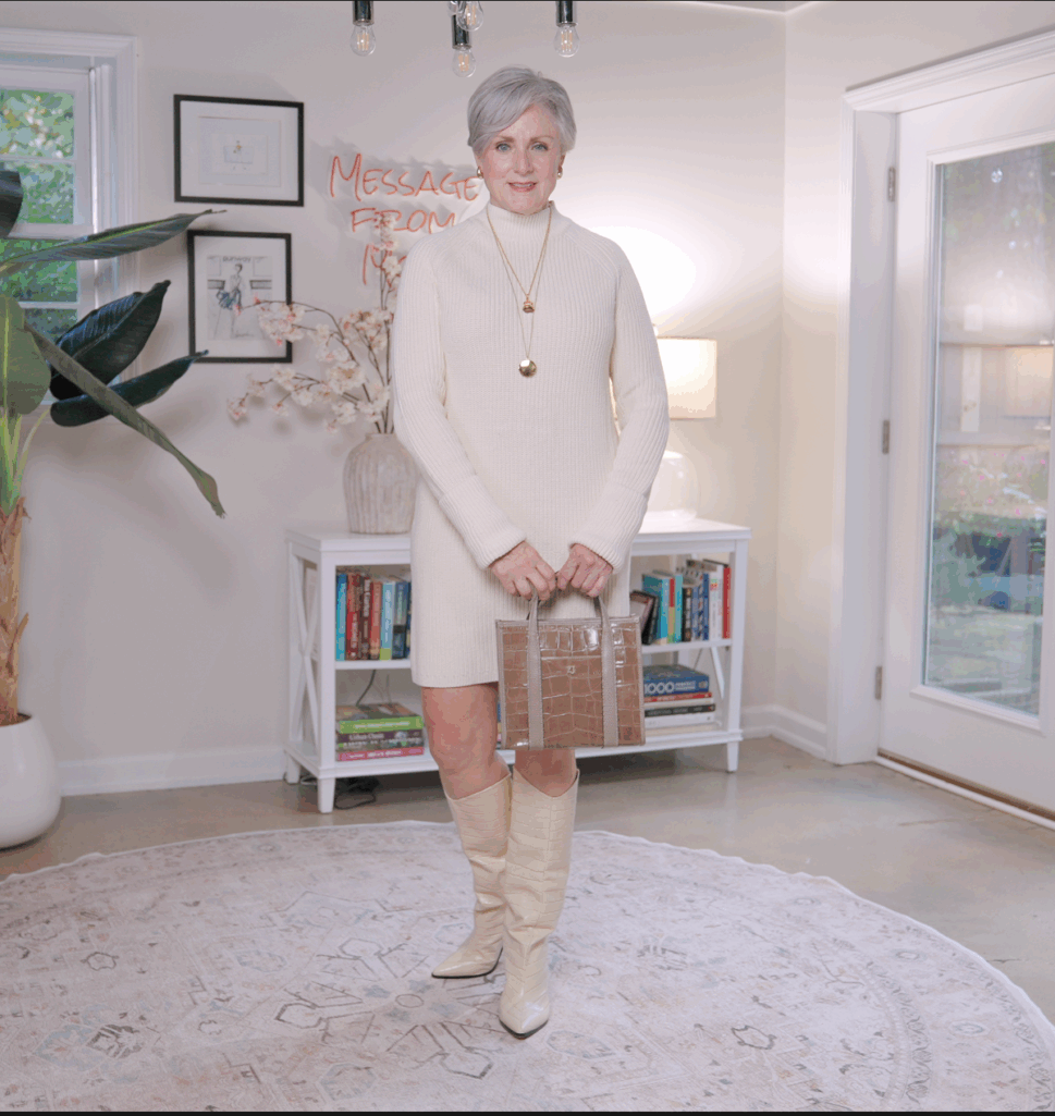 Cream sweater dress with knee-high boots and belt — elegant fall outfit for women over 50.