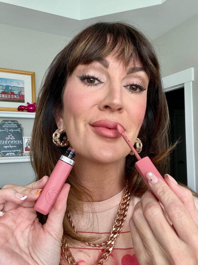 woman applying lipstick