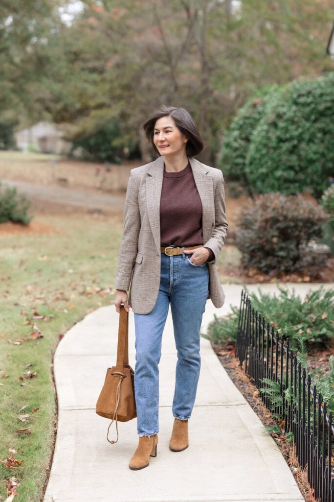 Kelly wearing elevated casual petite outfit formula with plaid blazer, cashmere sweater, high waist crop jeans and suede ankle boots