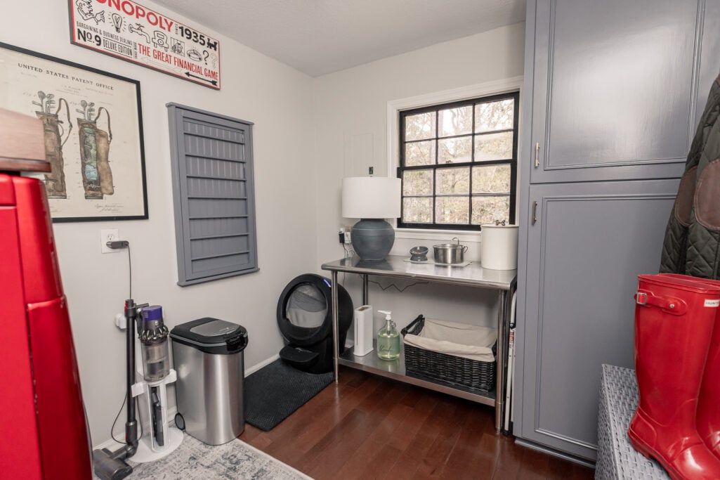 laundry room makeover artwork, lamp, and dyson vacuum