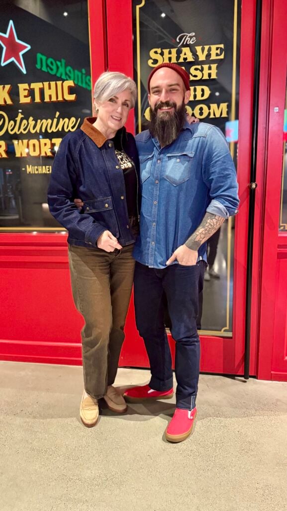 Beth Djalali wears a Beatles graphic tee, Levi’s Ribcage Jeans, and Madewell denim jacket before Paul McCartney concert in Atlanta.