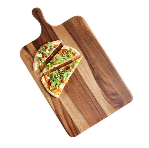 Acacia wood serving board with a paddle handle, shown with a sliced flatbread pizza topped with greens and vegetables arranged on the board.