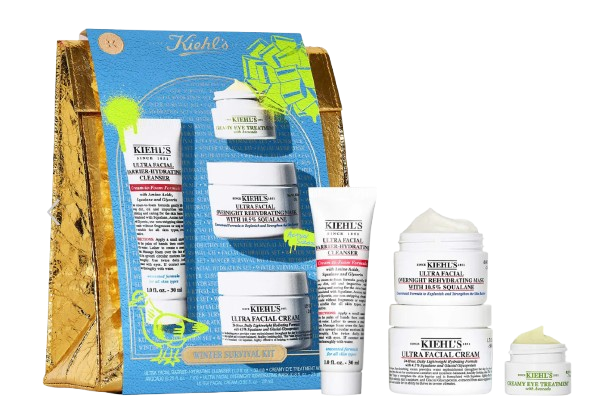 Kiehl’s Winter Skincare Gift Set including Ultra Facial Cleanser, Ultra Facial Cream, Overnight Rehydrating Mask with squalane, and mini moisturizing treatments, displayed with blue and gold holiday packaging.