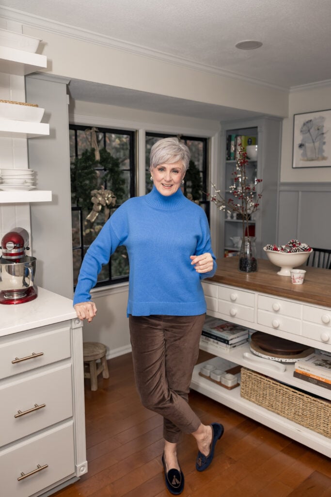 blue turtleneck with brown pants winter outfit for women over 50