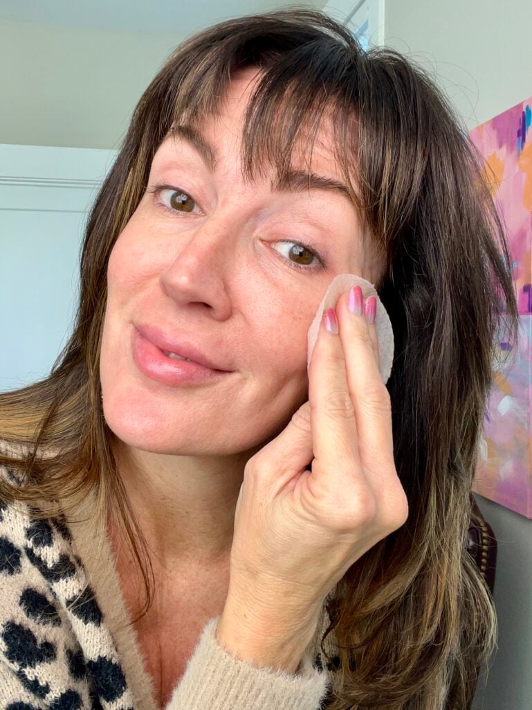 ennifer applying Biodance toner pad to face showing application technique - how to use toner pads for smoother skin