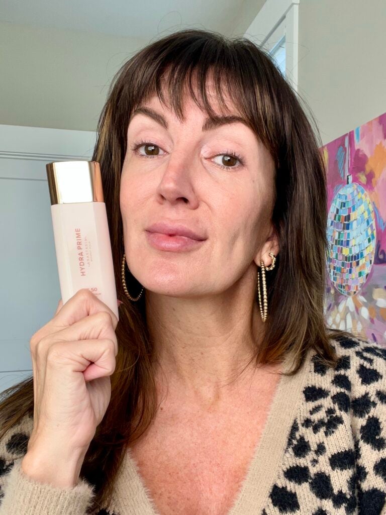Jennifer holding Anastasia Beverly Hills Hydra Prime SPF 50 - sunscreen primer for mature skin