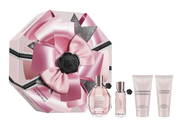 Viktor & Rolf Flowerbomb Gift Set featuring a pink, bow-wrapped decorative box, a full-size Flowerbomb perfume bottle, a matching mini travel spray, and two coordinating body lotions in the signature floral scent.