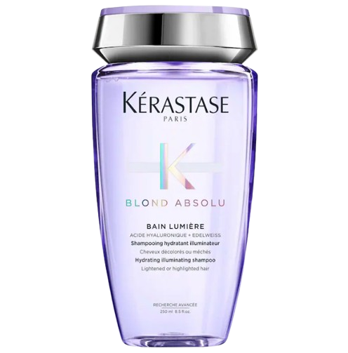 Bottle of Kérastase Blond Absolu Bain Lumière hydrating illuminating shampoo in a metallic lavender container with a silver cap, designed for lightened or highlighted hair.