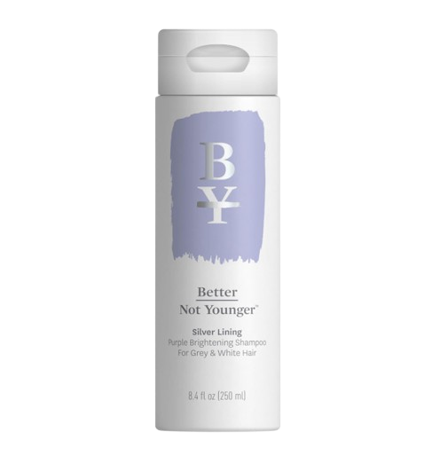 Better Not Younger Silver Lining Purple Brightening Shampoo in a white bottle with a lavender brushstroke design, created for grey and white hair.