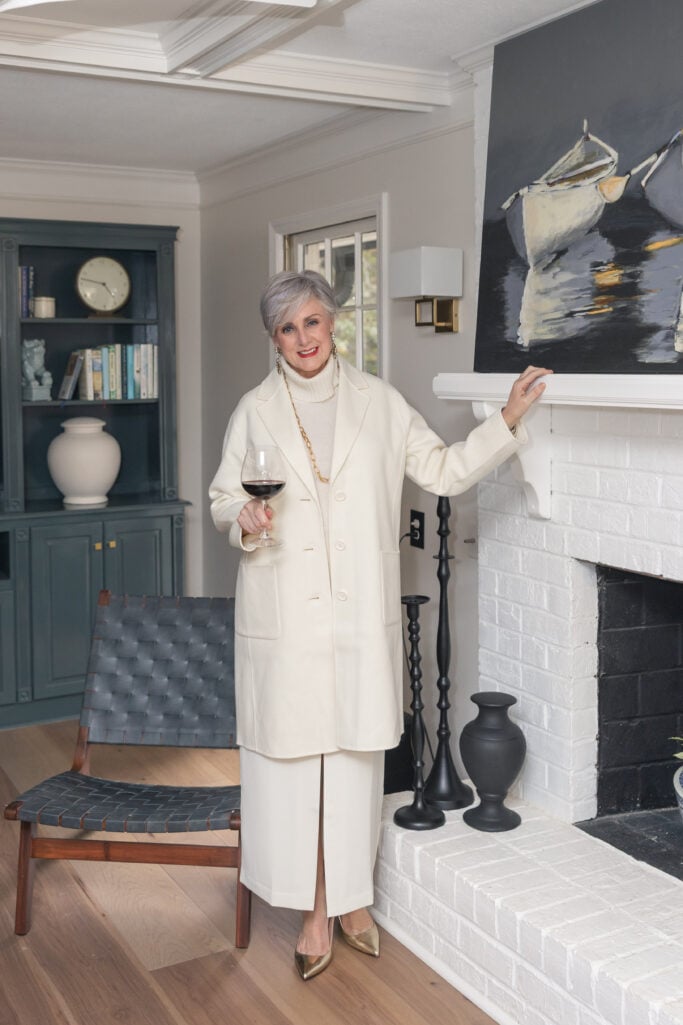 Elegant winter white tailored coat outfit with midi skirt and gold pumps