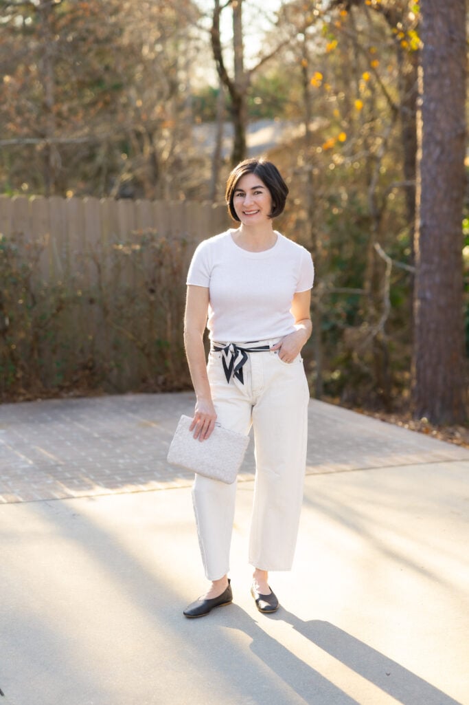 Casual winter white outfit with barrel leg jeans and relaxed tee