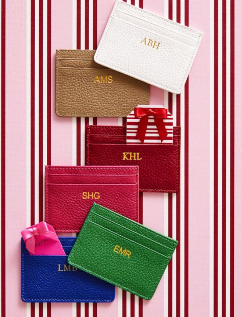 Colorful monogrammed leather card cases from Mark and Graham in white, tan, red, pink, blue and green with gold personalization