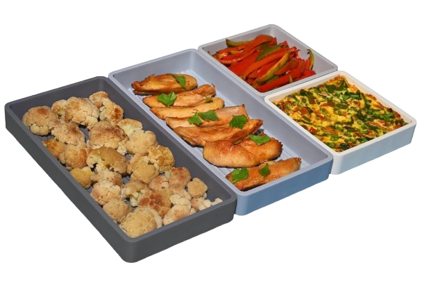 Flexible silicone sheet pan dividers separating roasted cauliflower, chicken, peppers, and egg bake, designed to keep foods separate during cooking.