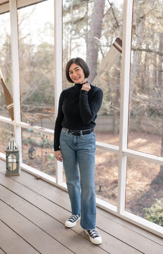 Kelly in petite straight leg jeans full length showing classic straight silhouette with Converse high top sneakers - casual petite denim styling