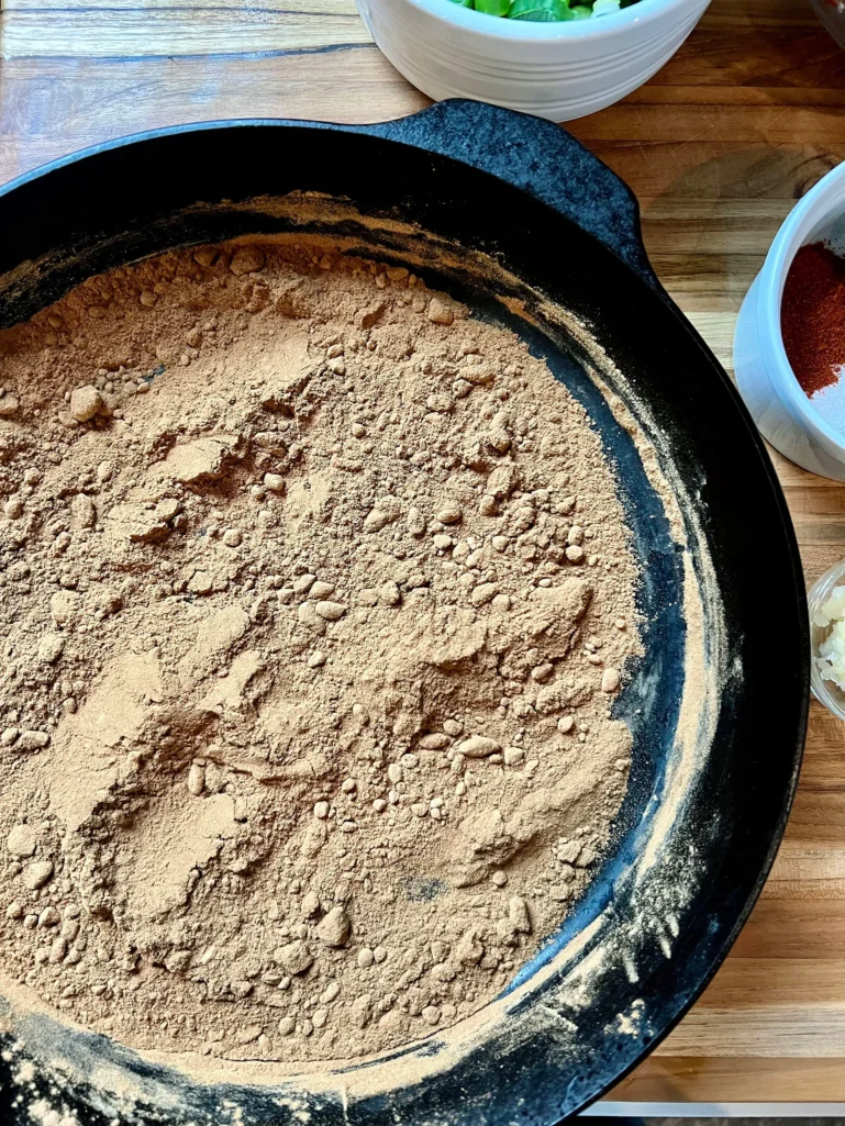 Flour toasted to a deep cinnamon brown color in a cast iron skillet